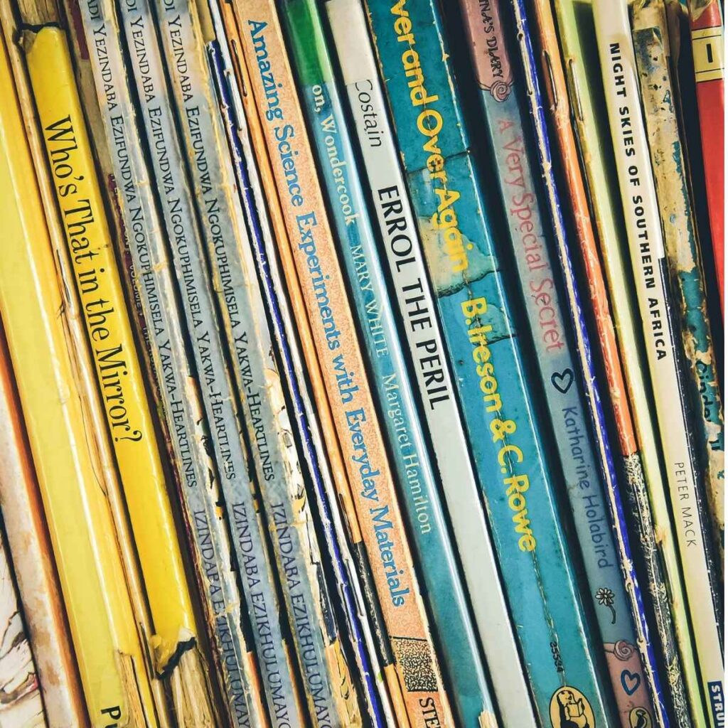 children's books lined up on a bookshelf