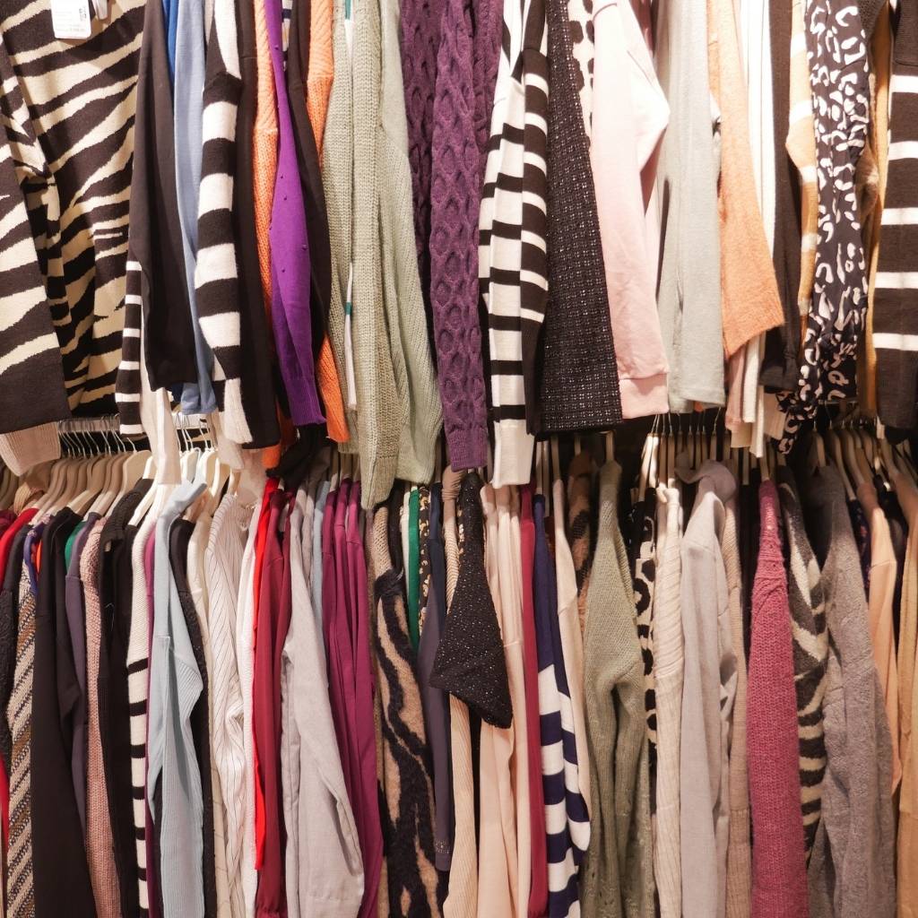 a closet full of clothing items