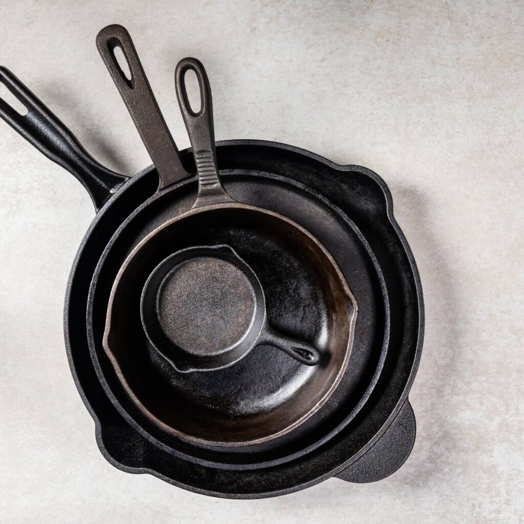 several cast iron skillets