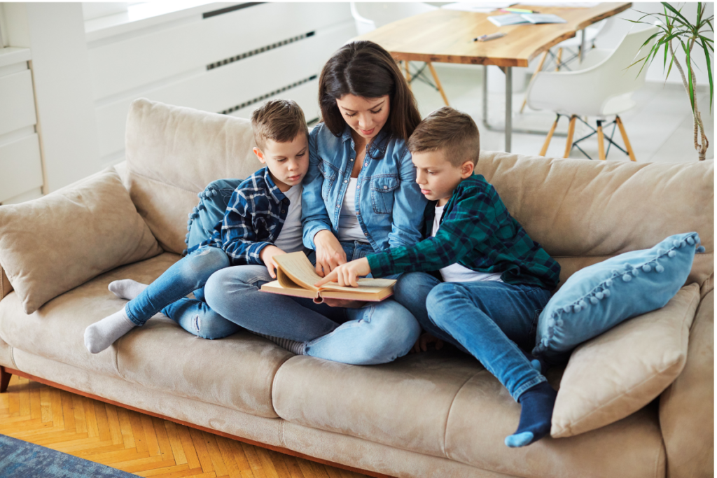 mother on couch homeschooling her children